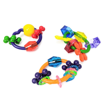 Colorful parrot foot toys with different shapes and sizes on a white background