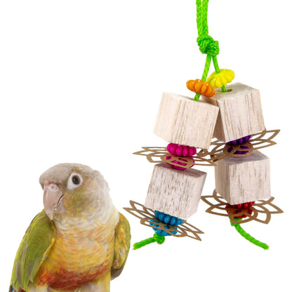 Bird toy with wooden blocks and colorful beads next to a parrot on a white background