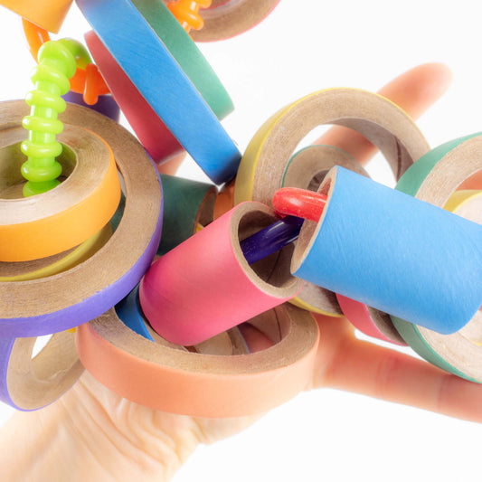 A close up of the birdie bagels on this bird toy