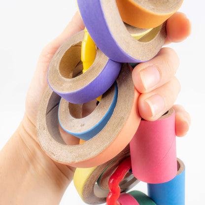 A close up of a hand holding the toy to show scale