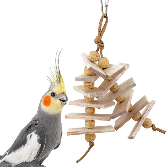 A cockatiel reaches out to a balsa bird toy.