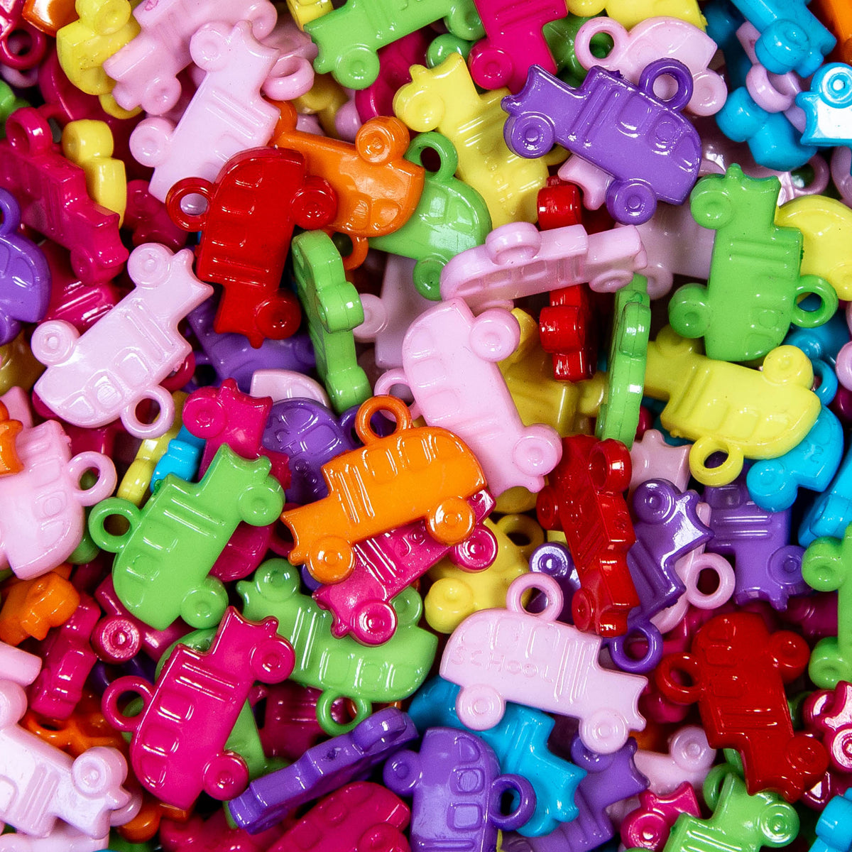 Brightly colored opaque acrylic school bus charms for pet toys, jewelry, and back-to-school crafts