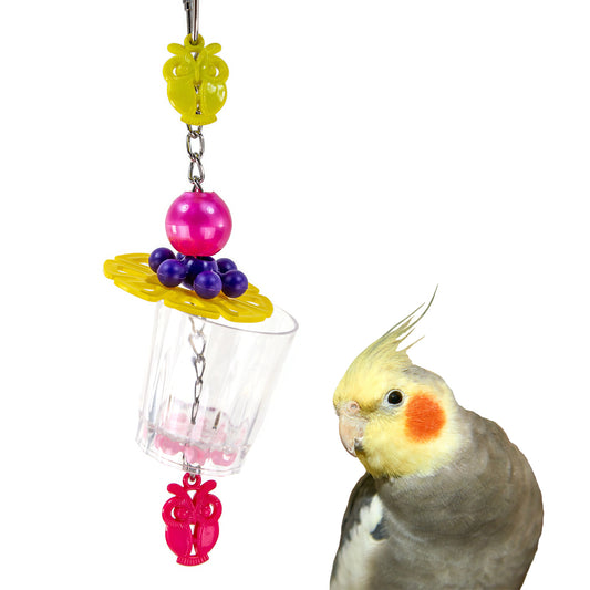 Owl themed foraging bird toy with a clear food cup shown with a cockatiel.