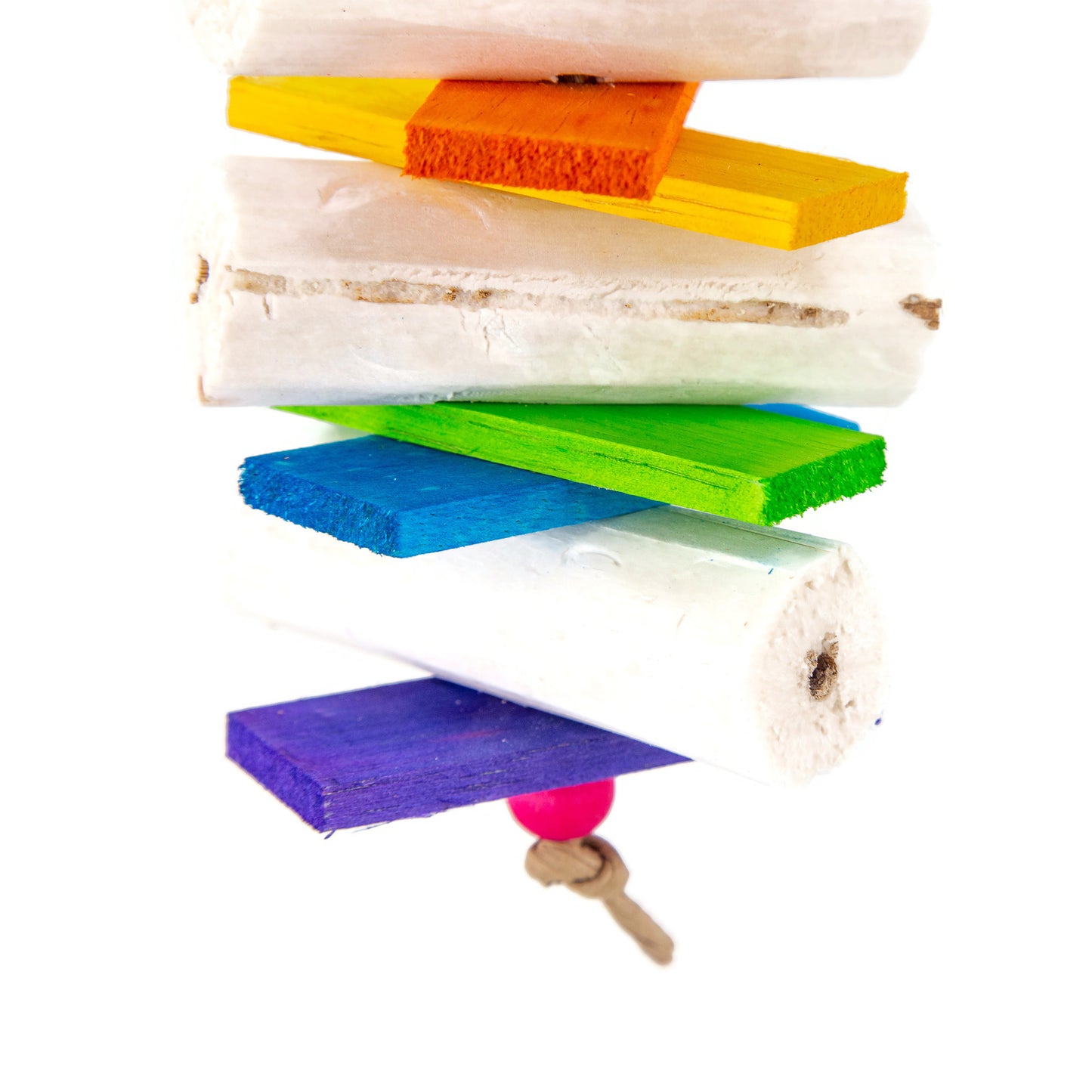 The bird toy features soft cream colored sola sticks and brightly colored balsa, each piece is colored separately to produce a rainbow of colors.