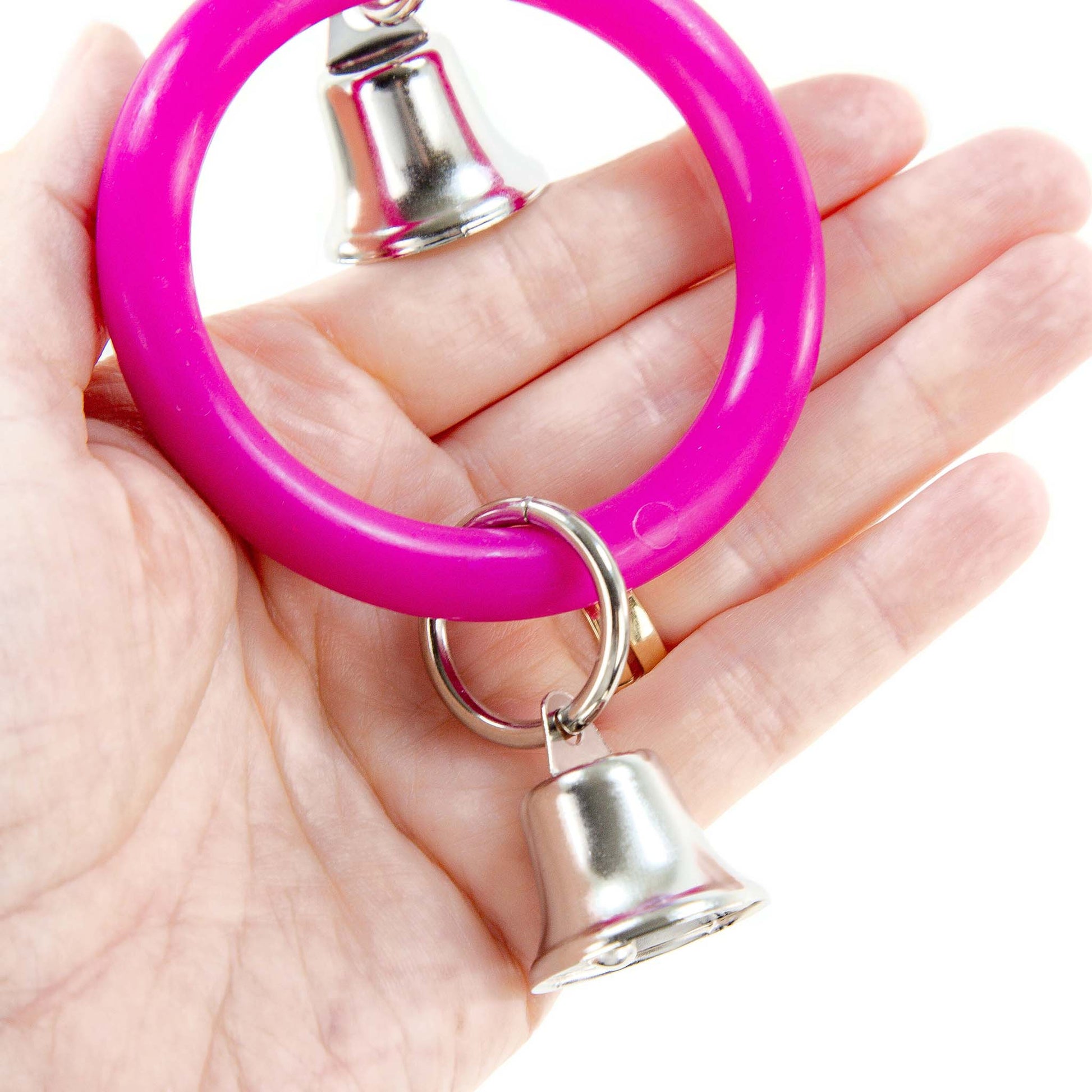 Close up of the bottom of the bird toy held in a hand.