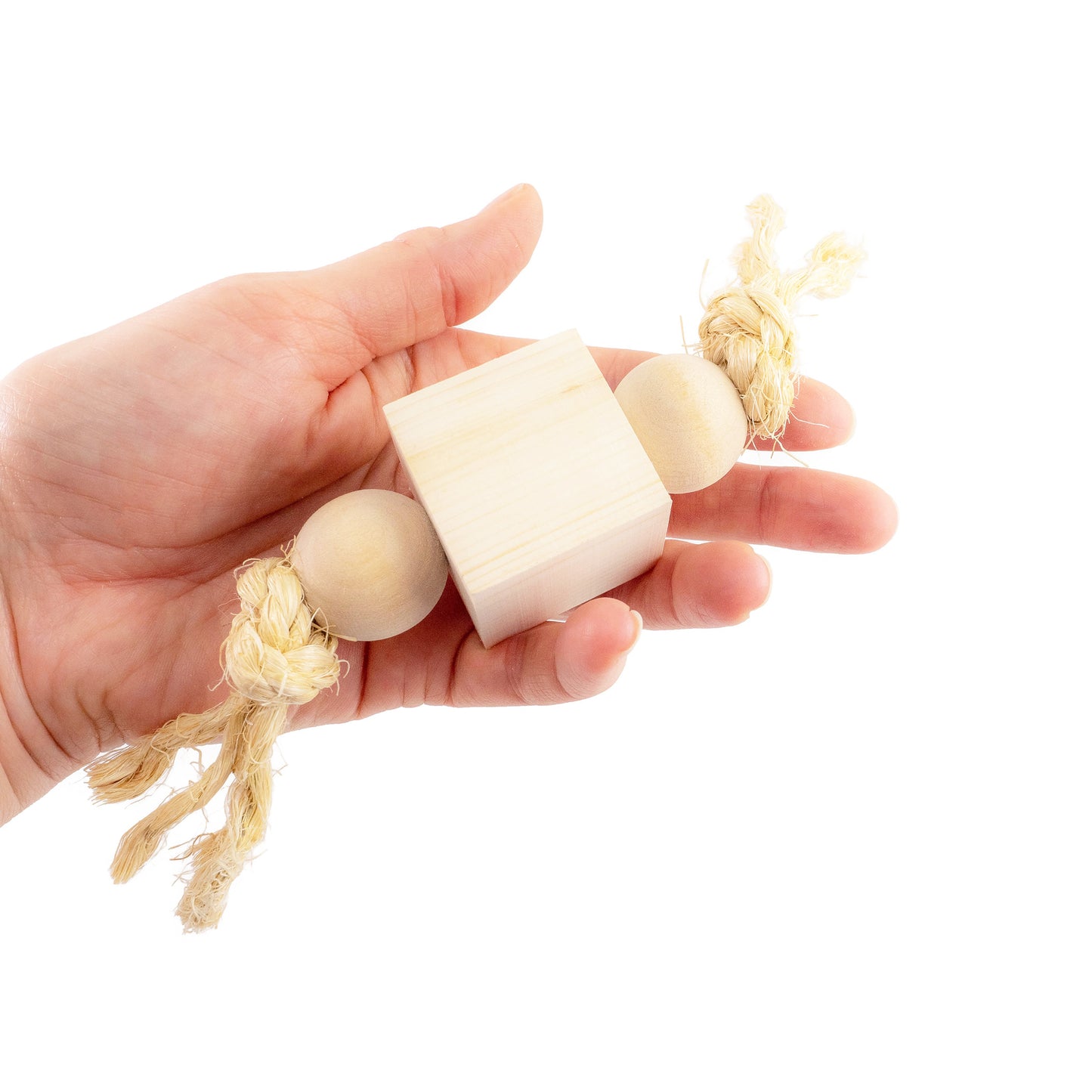 Hand holding natural wood blocks strung on untreated sisal.