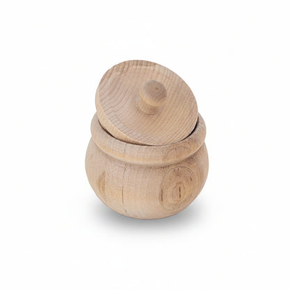 A small round wooden lidded container with a matching lid, made from light natural wood with visible grain patterns, set against a plain white background.