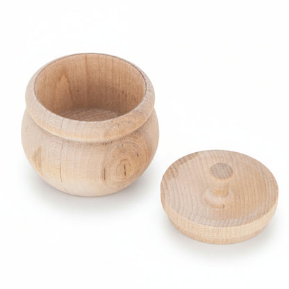 A small round wooden container with an open top and a separate matching lid, shown on a clean white background.