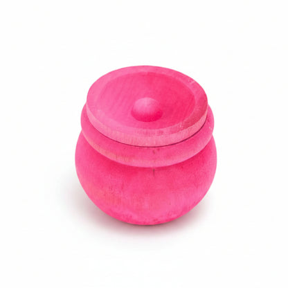 A small round, vibrant pink wooden box with a lid.