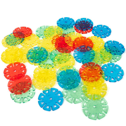 Colorful plastic abstract flower-shaped objects on a white background